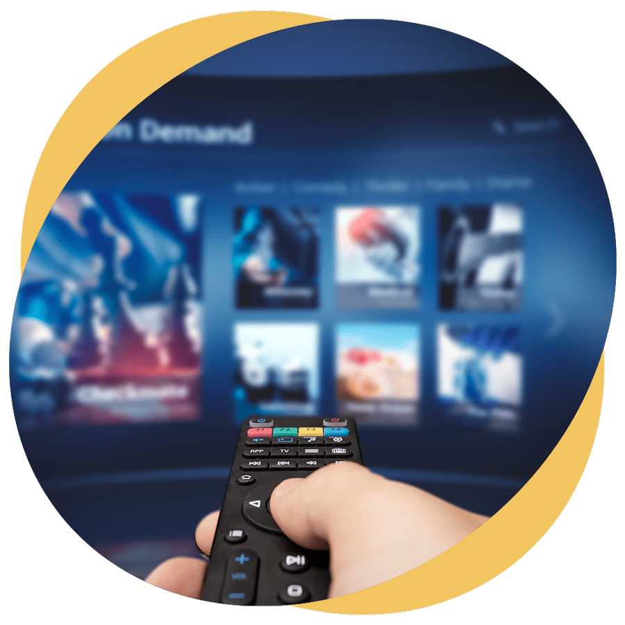 A hand directing a remote control towards a streaming TV interface